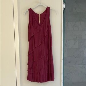 Elegant Sleeveless Raspberry Pink Dress with soft, flowy tiers.